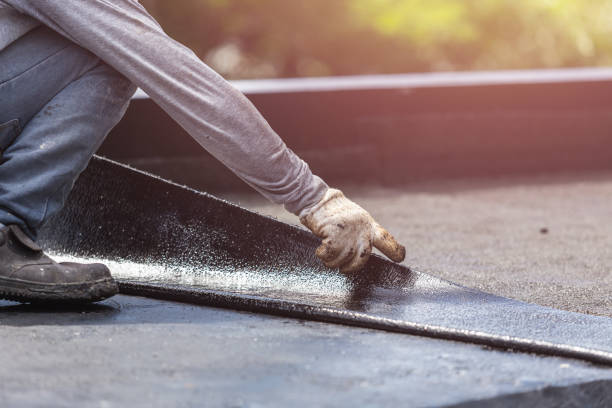 Professional Waterproofing technician working in West Sayville, NY